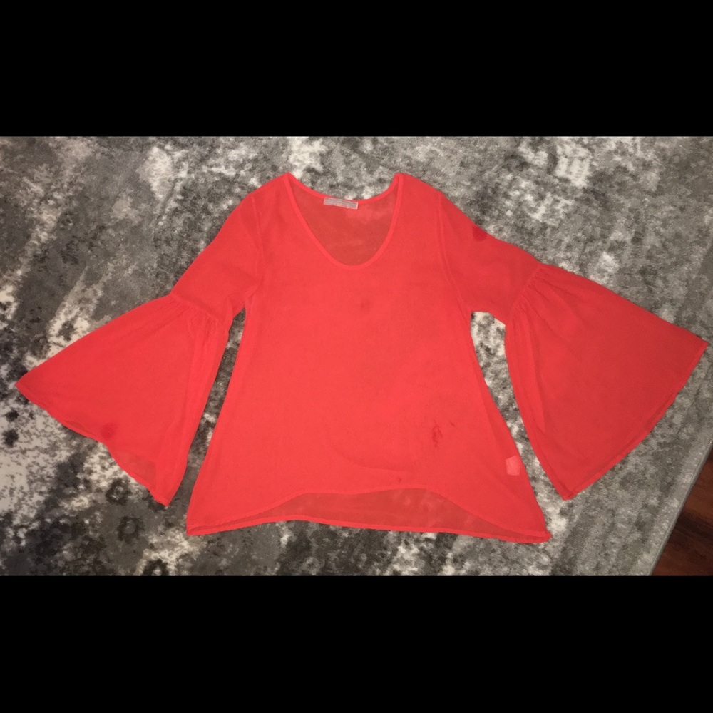 Orange blouse with bell sleeves
